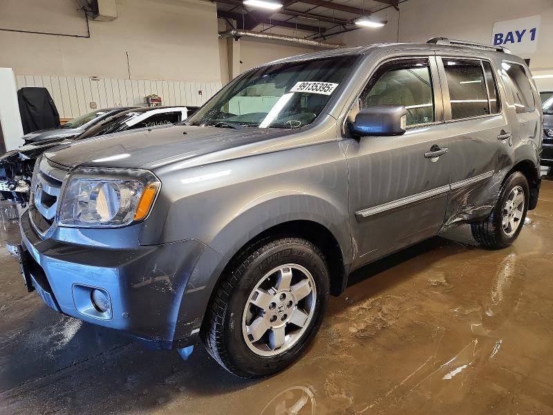 2011 HONDA PILOT TOUR — VIN 5FNYF4H94BB090897
