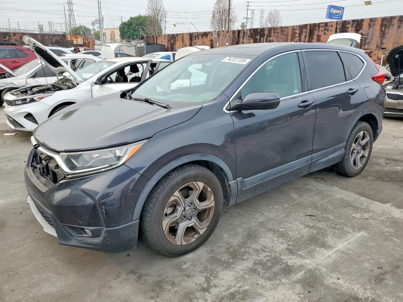 2018 HONDA CR-V — VIN 2HKRW1H59JH516079
