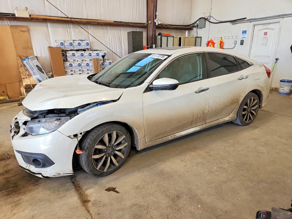 2017 HONDA CIVIC TOURING 4DR — VIN 2HGFC1F98HH102202